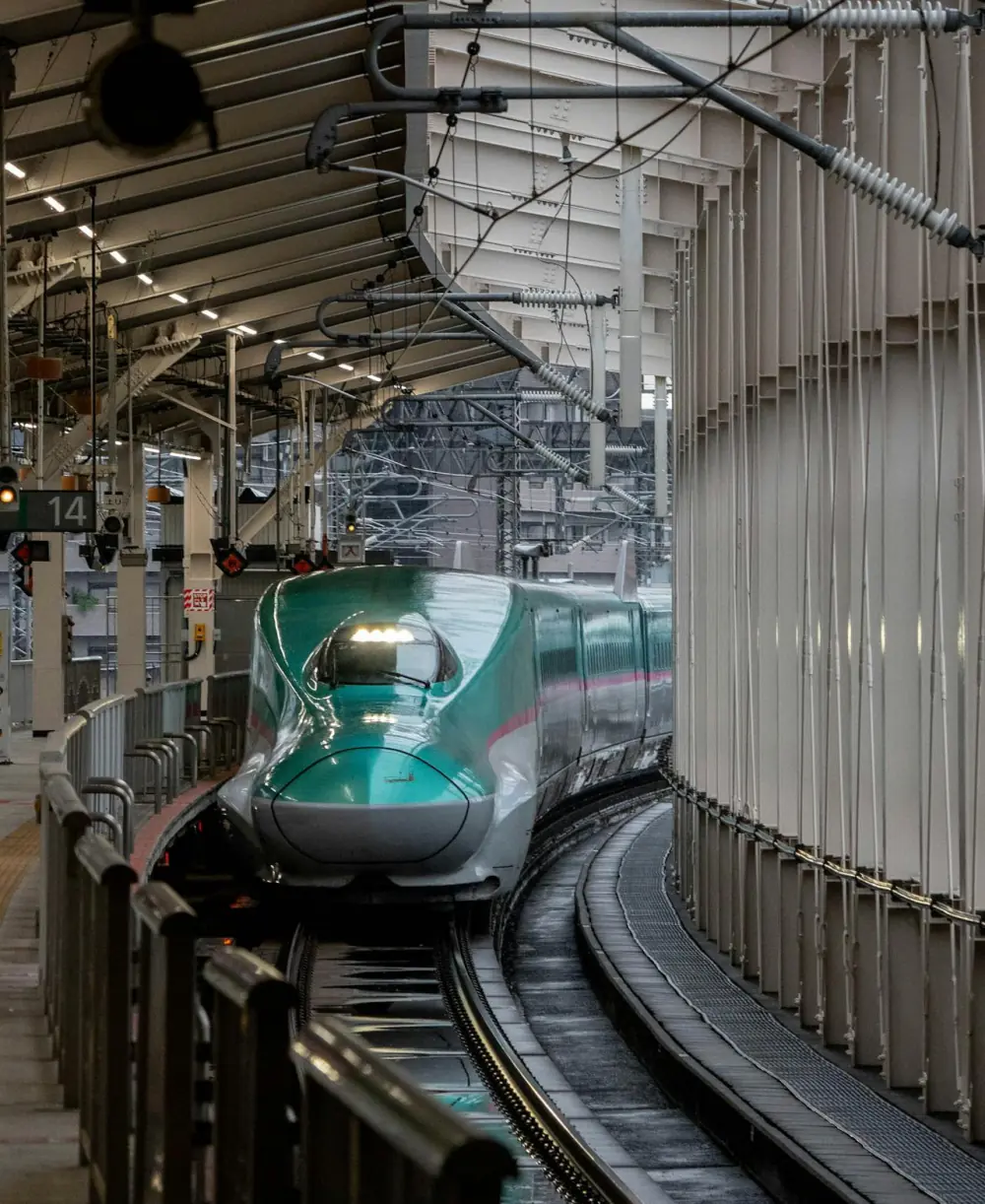 Shinkansen arriving at a station